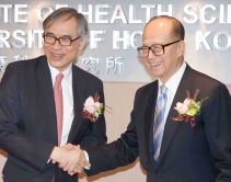 Professor Lawrence J. Lau, Vice-Chancellor of CUHK, and Dr Li Ka-shing congratulate each other at the unveiling ceremony of Li Ka Shing Institute of Health Sciences.