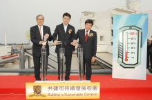 Prof. Lawrence J. Lau, Mr. Edward Yau and Prof. Lam Kin Che (from left) power on the solar water heater system for the CUHK student hostels.