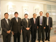 Vice-Chancellor Lawrence J. Lau (3rd right) receives Dr. Tarantino (3rd left) and the USRA delegation