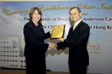 Professor Tai Fai Fok presents a memorial plaque to Dr. Karen K. Fields