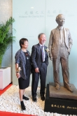 Professor Sir Charles Kao shows his sense of humor by posing like the gesture of the statue