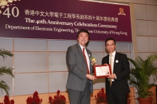 Prof. Joseph Sung presents the Distinguished Alumni Award to Mr. Ricky Wai-kay Wong (right)