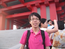 Wong Chin Leung poses in front of the China Pavilion