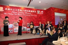 The audience, including Vice-Chancellor Prof. Joseph J.Y. Sung, is deeply impressed by the Beijing operatic singing presented by Mr. Lee Woo-sing (1st right), the first Vice-Chairman of the Board of Trustees, Shaw College, Mrs. Lee (1st left) and Ms. Ge Lan (2nd left), a veteran famous star.