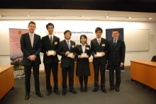 The champion team ‘Benchmark’ receives the award from Mr. Debruyne and Prof. Wong.