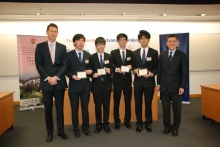 The third place winning team ‘The One’ receives the award from Mr. Debruyne and Prof. Wong.