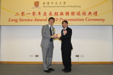 CUHK Vice-Chancellor Prof. Joseph J.Y. Sung presents a certificate and a gold lapel pin to Dr. Simon Lee