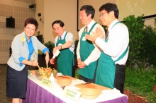 Dr. Poon Kit, Kitty gives a hand to prepare the green salad.