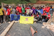 Students of S.H. Ho College work with local workers in Uganda to build a student dormitory with their bare hands.