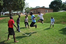 The students visit many children's villages and play games with them.