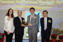 Prof. Joseph Sung presents a CUHK 50th anniversary souvenir to Dr. & Mrs. Alex Yasumoto.