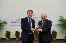 Prof. Joseph Sung (left) presents a CUHK 50th anniversary souvenir to Mr. Justice Geoffrey Ma.