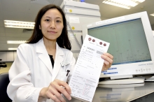 Dr. Liz Yuet Ping YUEN, Consultant, Department of Chemical Pathology, CUHK,showsthe sample filter paper for IEMscreening test.