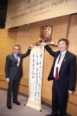 Prof. Joseph Sung presenting his calligraphy as a token of appreciation to Mr. Edward Cheng