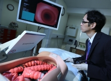 Dr Raymond S.Y. Tang , Associate Director (Clinical), S.H. Ho Centre for Digestive Health demonstrates endoscopy with State-of-the-Art medical equipment at the centre.