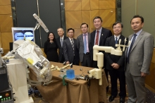 A group photo of the three officiating guests and CUHK researchers involving in the development of biomedical robotics, including Dr. Carmen Poon, Department of Surgery (1st left); Prof. Yeung Yam  (2nd left)and Prof. Yunhui Liu (1st right), Department of Mechanical and Automation Engineering; and Prof. Leung Kwok Sui (2nd from right), Department of Orthopaedics and Traumatology.