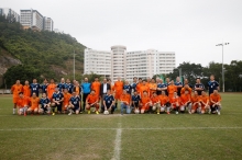 A group photo of the two teams.