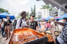 Visitors tasting Korean food