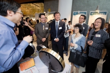 Prof. Joseph Sung and guests visit the exhibition booths.