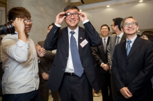 Prof. Joseph Sung and guests visit the exhibition booths.