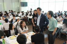 Prof. Joseph Sung welcomes new students during a breakfast session.