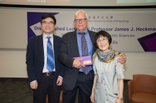 Prof. Fanny M.C. Cheung, Pro-Vice-Chancellor of CUHK (right) presents a souvenir to Prof. James J. Heckman. Prof. Junsen Zhang, Wei Lun Professor of Economics and Chairman of the Department of Economics, CUHK is at the left side of this photo.