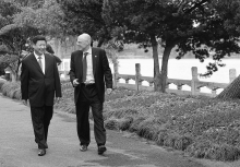 Paulson’s first trip to China as Treasury Secretary in September 2006, visiting with future president Xi Jinping at Hangzhou’s famed West Lake State Guest House (AP Photo/Eugene Hoshiko)