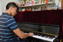 Mr Hanniel Chow plays the piano and ukulele very well