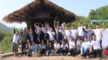 A group photo taken in the completion ceremony of the “Yi Xin Qiao” in Dujia Village, in the Yubei district in Chongqing on 8 April 2018.