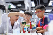 Children learning how waste water can be purified using safe chemicals and tools.