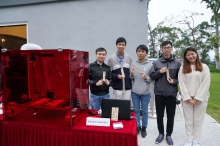 A CUHK team demonstrates the production of wooden book marks by a cable-driven laser cutting robot.