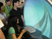 Students experience a virtual roller coaster game using tele-immersion technology at the Virtual Reality Visualization and Imaging Research Centre of CUHK