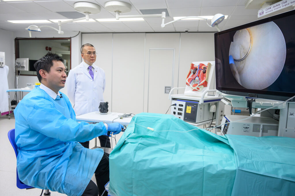 Dr Jeremy Teoh performs a mock demonstration of ERBT, by using a cystoscope to enter the bladder through the urethra and resect the bladder tumour in one piece.