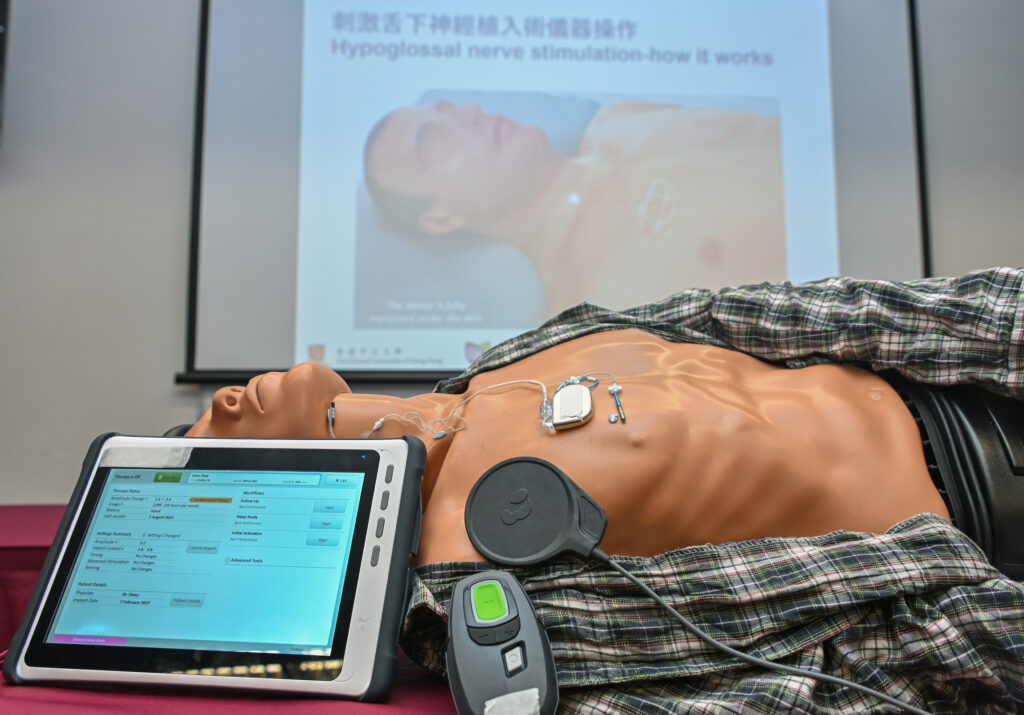 Doctors and nurses can read the manual and clinical data in the UAS device implanted in patient’s body by placing the sensing pad (black circle pad) on top of the device.