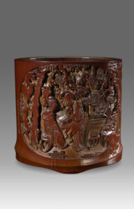 Bamboo brushpot with ladies reading in garden<br />
Late Ming (first half of 17th century)<br />
Diameter: 15.5 cm (mouth) & 13.1 cm (base); height: 14.9 cm<br />
Collection of Shanghai Museum