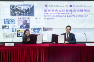 Signing of donation agreement by Ms Cheong-Leen (left) and Mr Meunier (right).