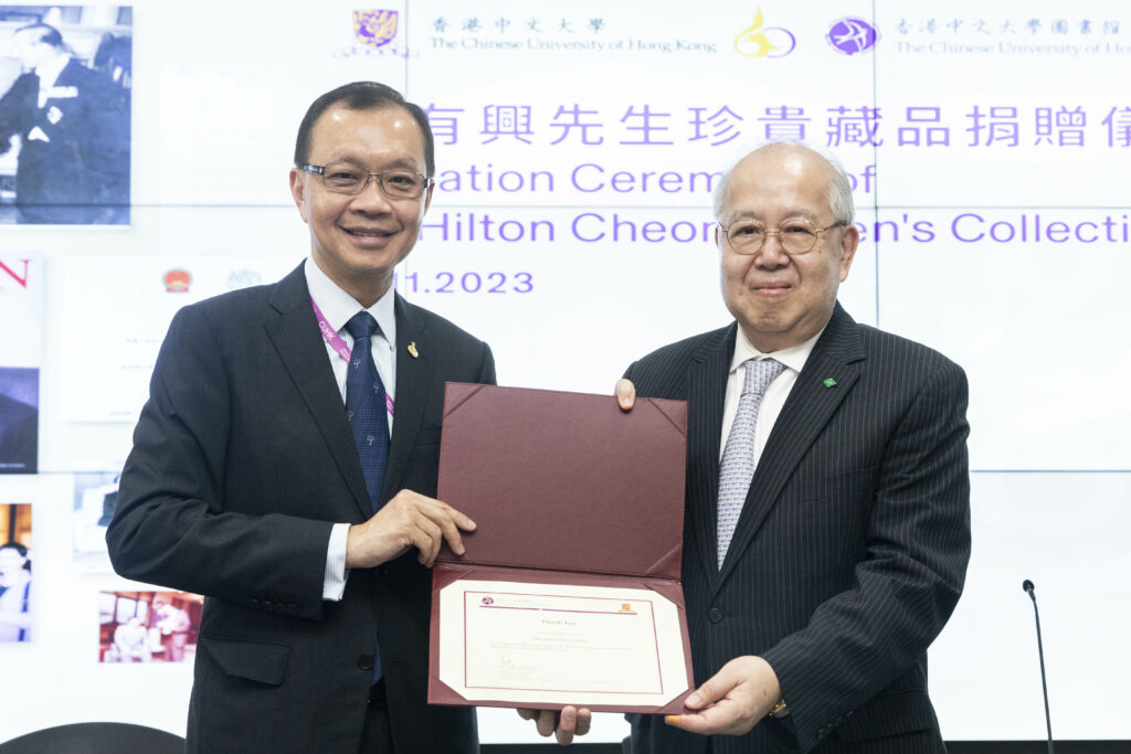 Presentation of thank-you certificates to Mr Lynn (right) from Mr Ng (left).