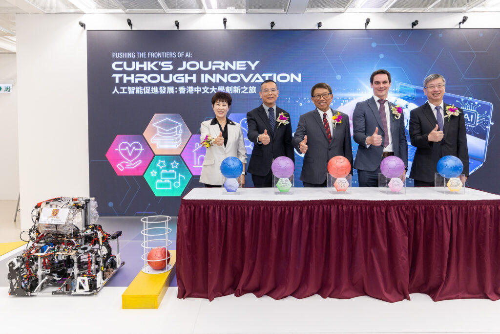 The officiating guests inaugurate the exhibition.<br />
(From right) Professor Tsang Hon Ki, Faculty Dean of Engineering at CUHK; Mr Benjamin Meunier, University Librarian at CUHK; Professor Rocky S. Tuan, CUHK Vice-Chancellor and President; Mr Alvin Zou, Vice President and General Manager of South Region, Asia Pacific Business Group, SenseTime; Ir Alice Chow, Senior Vice President of the Hong Kong Institution of Engineers.