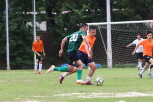 Players from both teams compete hard during the game.