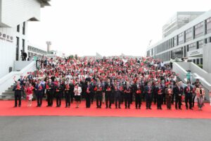 A group photo of all guests at the flag-raising ceremony.