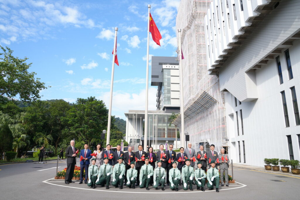 The University officers and guests with the student flag-guard team.