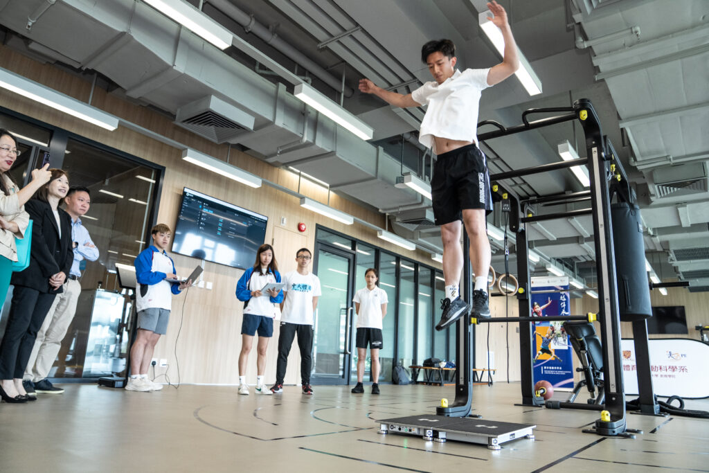 Athletes demonstrate vertical jump using the portable force plate.