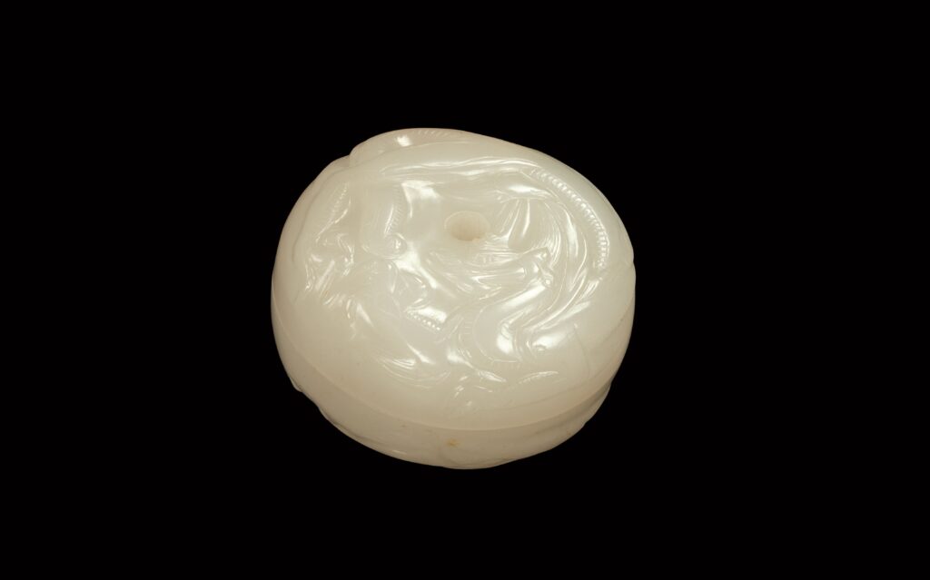 White jade annular box with dragon design<br />
Five Dynasties to Northern Song Dynasty<br />
Gift of Bei Shan Tang<br />
Acc. No.: 2008.0088