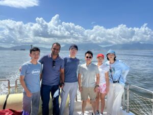 Professor Amos P.K. Tai (third from right), Deputy Chair (Education) of the Department of Earth and Environmental Sciences at CUHK, Yuan Nok-lam (second from right), former researcher at the Department, and their research team conducted a field survey of Chinese white dolphins in the waters near Tai O.